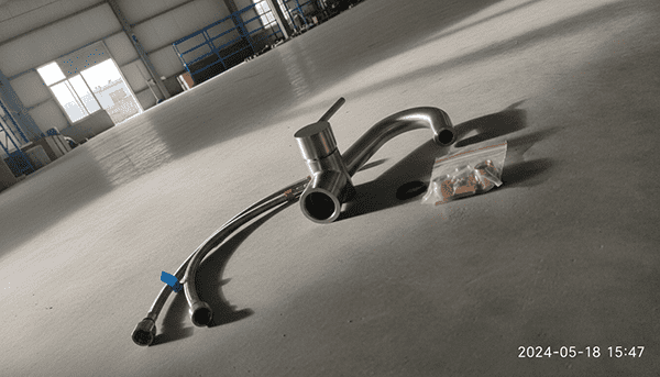 Complete Faucet Sourcing Package An image showing a complete faucet package: the faucet, braided stainless steel supply hoses, and all necessary mounting hardware neatly laid out.