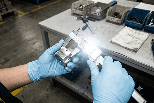 A detailed shot of a digital caliper measuring a metal part, emphasizing precision.